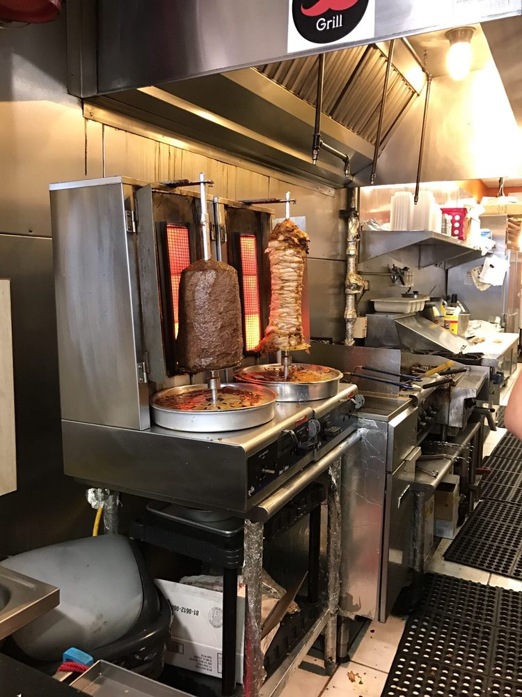 Beef and chicken shawarma roasting in the Al Basha Grill kitchen