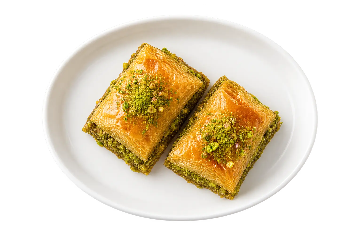 Two pieces of pistachio baklava on a white ceramic plate