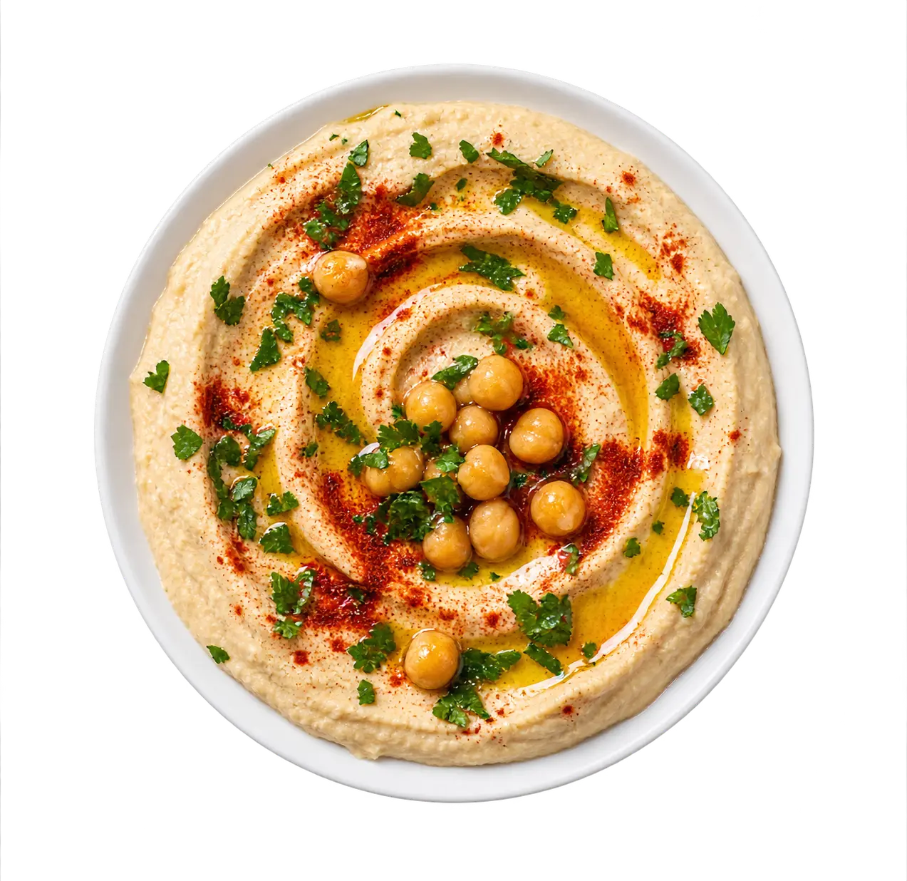 Bowl of hummus with chickpeas, olive oil and parsley